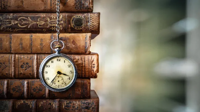 pocketwatch and books